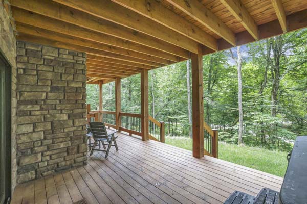 Shagbark Hickory Ridge, Hocking Hills — lower deck seating beside the stone chimney