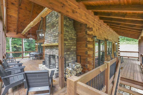 Shagbark Hickory Ridge, Hocking Hills — long upper deck with rocking chairs and forest views