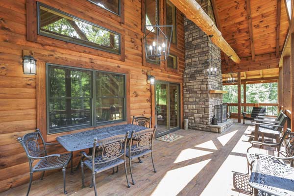 Shagbark Hickory Ridge, Hocking Hills — covered deck with the stone outdoor fireplace