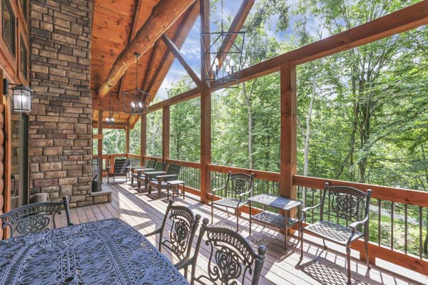 Shagbark Hickory Ridge, Hocking Hills — outdoor dining table beside the stone fireplace
