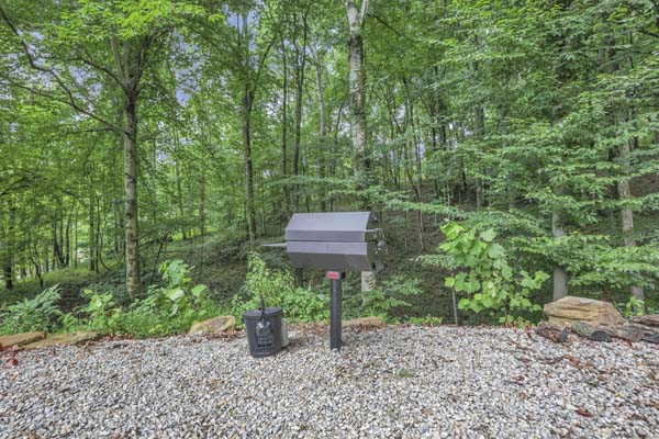 Shagbark Hickory Ridge, Hocking Hills — charcoal grill at the edge of the fire pit area